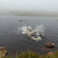 Red Tarn under Pike O Blisco. The meet leader trying to avoid wading through the sludge (Virginia Castick)