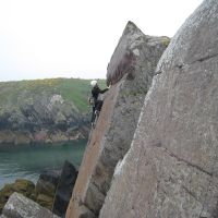 Dave leading Red Wall, Porth Clais (Roger Dyke)