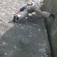 Tim bridging Keepers Crack, delaying heavy cam extraction (Roger Dyke)