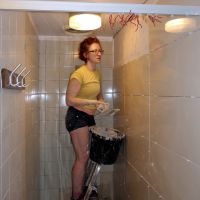 Emily tiling in the ladies shower (Dave Wylie)