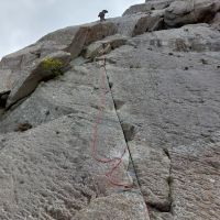 Dave clears the overlap and 2nd slab on P1 of Direct Route on the Milestone (Andy Stratford)