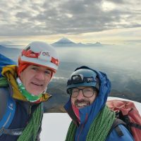 Steve and Andy Iliniza Sur summit with Cotopaxi in the background (Steve Graham)