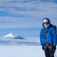 Stevie on the summit of Antisana 5705m with the perfect cone of Cotopaxi 5895m left (Andy Stratford)
