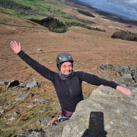 Claire Hawkins topping out on Flying Buttress (Andy Stratford)