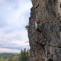 Tom pulling past the crux section of Cave and Crag, 7a (Daniel O'Brien)